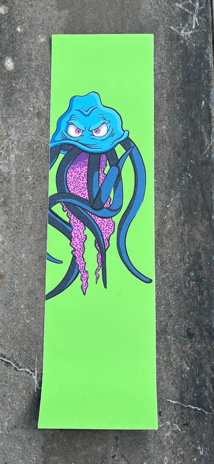 Baffled Panda Jellyfish graphic skateboard grip tape photographed on skatepark concrete