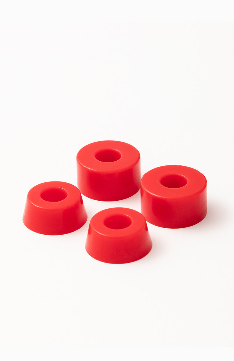 Four red Tremendous 88A soft skateboard truck bushings